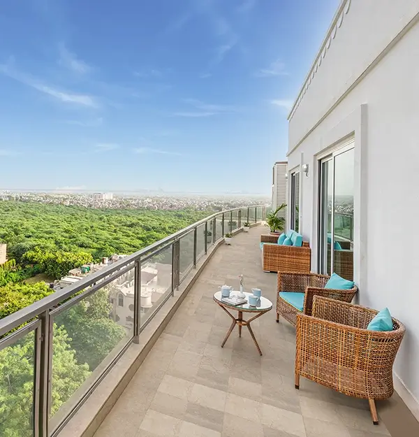 Scenic balcony view with natural beauty of the surroundings, lush greenery, fresh air, and open skies.