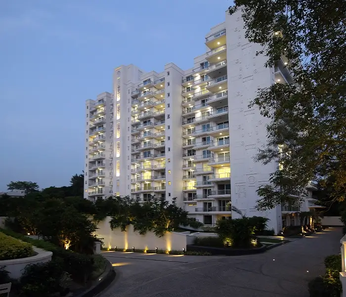 DLF Kings Court, luxurious high-rise residential building with a modern and sleek design.